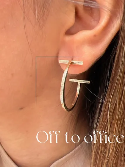These T-bar gold hoops are the perfect accessory for the office. Their clean lines and modern design add a touch of sophistication to your professional attire.
