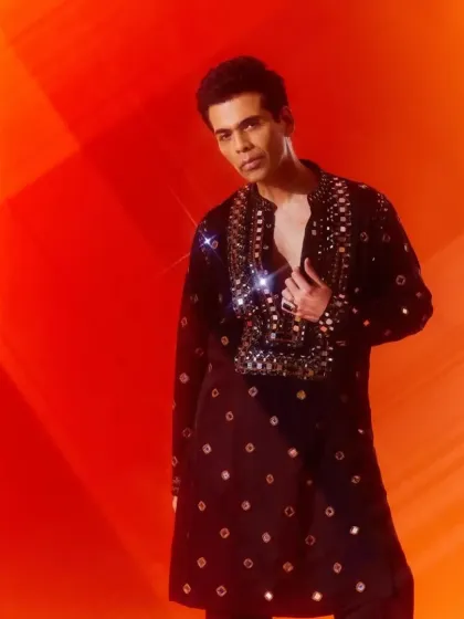 Another model wearing the black mirror-work kurta, showing its appeal across different personal styles.