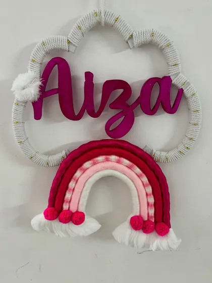 The 'Aiza' name hanging without lights, highlighting the rich pink and red color palette.