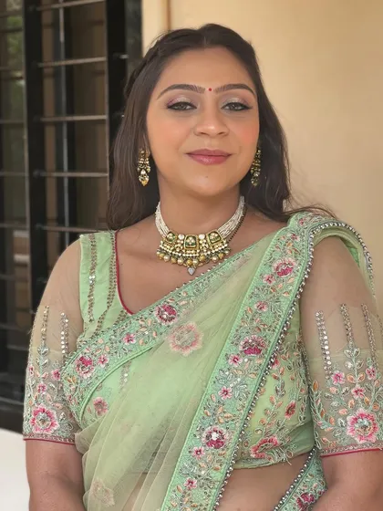 Glitter, glam, and royalty. A stunning look in a pastel green saree.