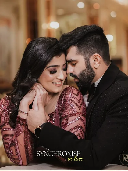 "Synchronise in love." A beautiful, intimate close-up of the couple during their engagement shoot, capturing a moment of quiet connection and affection.