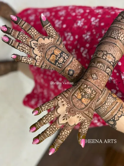 A stunning back-hand design featuring swans and auspicious symbols, perfect for a bride or her close family.