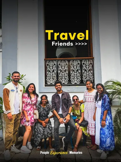 Travel friends are the best friends. A group of travelers, now friends, pose in front of a building with classic French architecture in Pondicherry's White Town.