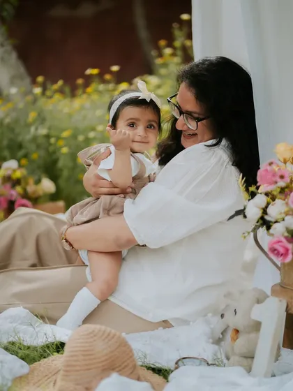 A mother's love. This tender moment between a mother and her daughter during their outdoor picnic session is what memory-making is all about.