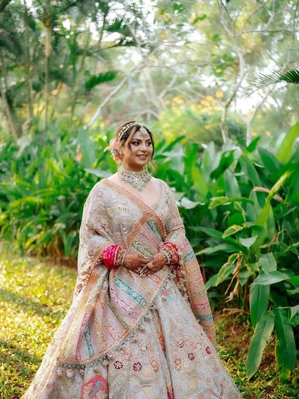 My bride Khyati, looking absolutely regal in her multi-toned lehenga. This is a perfect example of a grand, yet elegant, bridal look.