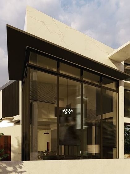A massive three-story glass volume dominates the corner of this villa, creating a transparent and light-filled interior. The sharp, angled roofline adds a dramatic, sculptural quality to the overall structure.