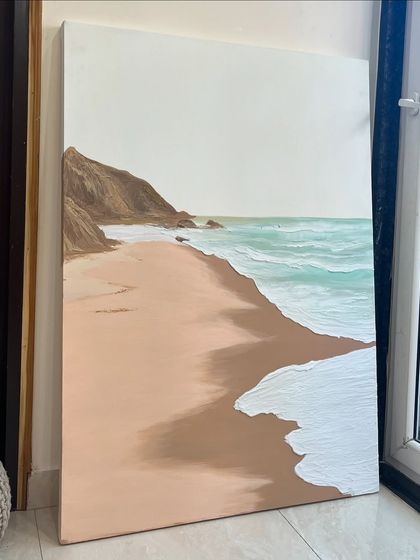 The full view of the large, vertical beach painting. This type of artwork can bring a sense of calm and escape to any room.