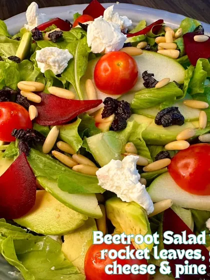 A close-up of my Beetroot Salad, tossed with rocket leaves, creamy goat cheese, and crunchy pine nuts. It's a perfect combination of earthy, peppery, and tangy flavors.