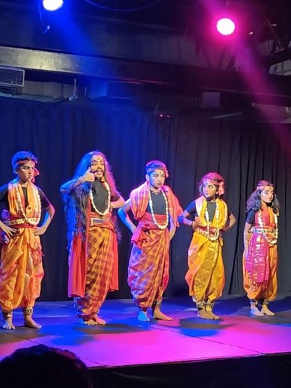 Dressed in vibrant costumes, our students perform a folk dance piece. Our summer camps introduce children to a variety of Indian performing arts, including Yakshagana, fostering a connection with our rich cultural heritage.