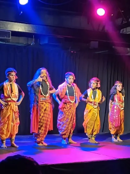 A lineup of our 'putta puttis' in vibrant costumes, ready to perform a traditional folk piece during their summer showcase.