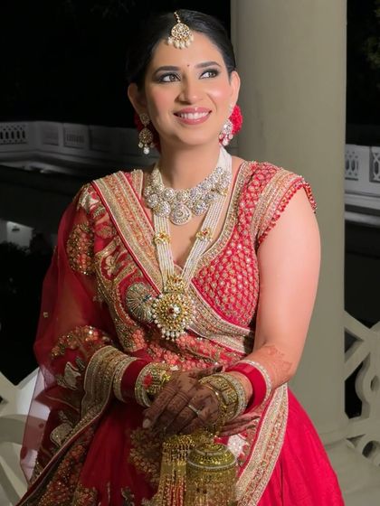 The perfect candid moment. Manika's smile shines, enhanced by a soft, timeless makeup look that highlights her natural beauty without overpowering it.