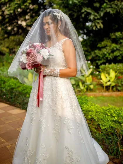 A classic bridal portrait with the veil. The soft makeup and romantic hairstyle create a look that is both traditional and modern.