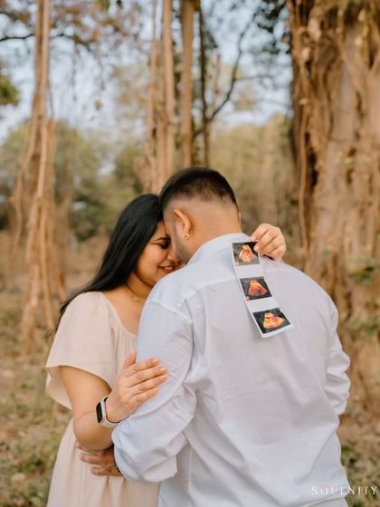 And then there were three! I love this creative idea of placing the ultrasound strip on dad's back for a sweet surprise announcement photo.