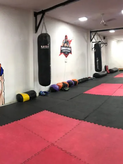 Welcome to our dojo. This is a no-excuse zone, a space with professional mats, heavy bags, and the warrior energy needed to forge champions.