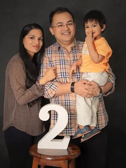 Two years of love and laughter. This classic family portrait marks a special second birthday milestone, with everyone together and smiling.