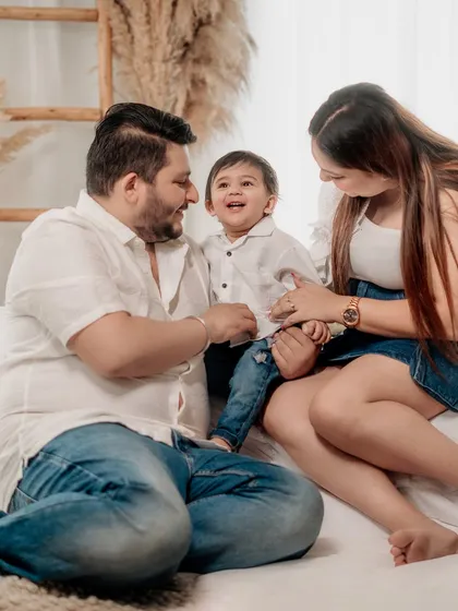 A beautiful, happy moment shared between a family. The laughter of a child is infectious, and I love capturing it during our relaxed studio sessions.