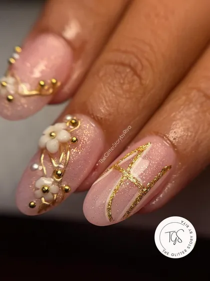 Personalization is key for bridal nails. For this set, I incorporated the bride's initial 'A' in a beautiful gold script, alongside 3D white flowers and gold beadwork for a truly custom touch.