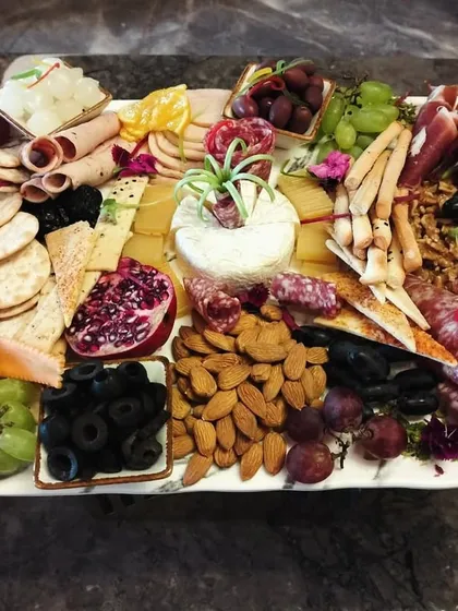 A feast for the eyes and the palate. Our abundant charcuterie boards are thoughtfully arranged with a premium selection of cured meats, artisanal cheeses, fresh fruits, and crisp crackers for a perfect grazing experience.