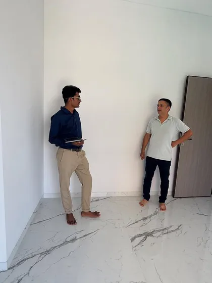 A new project begins. Here I am with the client in their empty flat in Borivali, ready to start the design process.