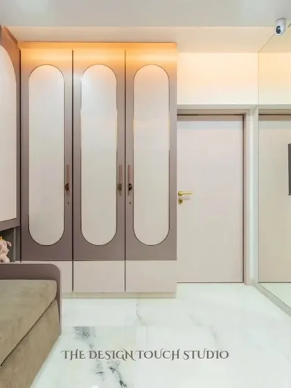 A view of the room with the Murphy bed folded away, showcasing the elegant wardrobe design and the spacious feel of the room. This demonstrates the versatility of multi-functional furniture.