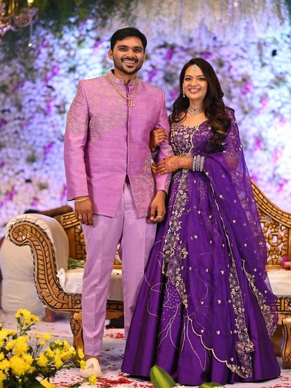 This photo showcases the bride's complete reception look. The elegant makeup and hair are the perfect finishing touches to her stunning outfit.