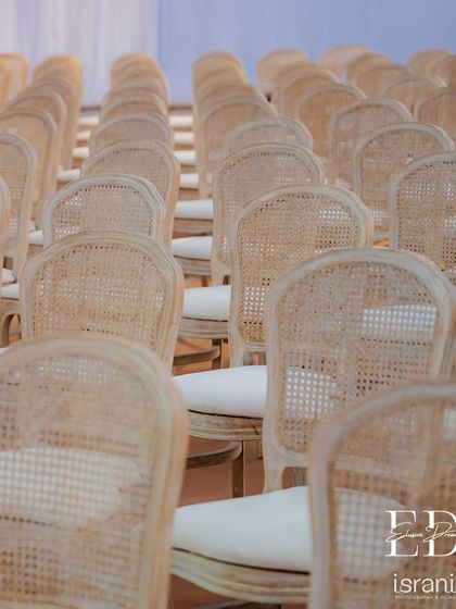 The texture and pattern of the natural cane chairs provide a beautiful, organic element to the decor. This choice reflects a commitment to sustainable and mindful design.