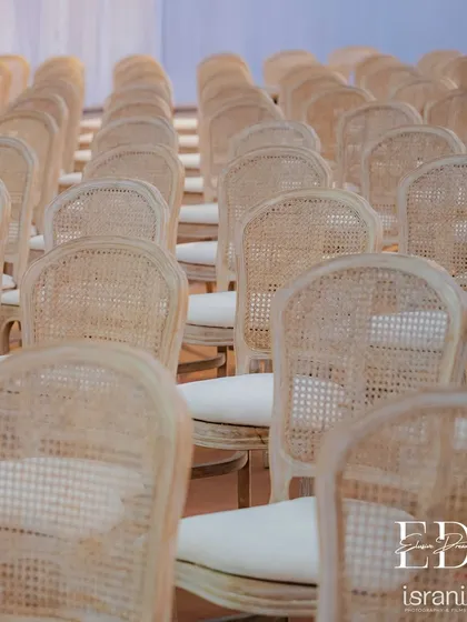 The texture and pattern of the natural cane chairs provide a beautiful, organic element to the decor. This choice reflects a commitment to sustainable and mindful design.
