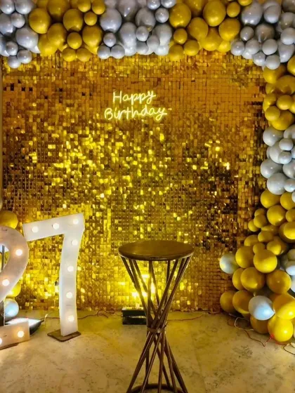 Our sequin backdrops add a touch of glamour to any event. This birthday setup combines a shimmering wall with marquee numbers and a balloon garland for a picture-perfect celebration.