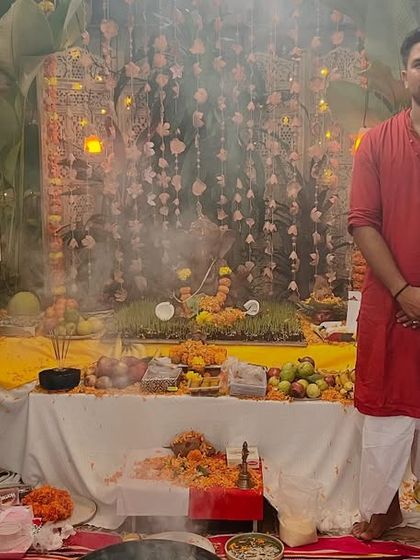 A portrait of our core team and family in front of the beautifully decorated Ganesha pandal. This festival is a special time for us to come together and celebrate our shared values.