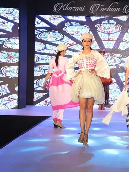 The finale walk of a student collection, where multiple designs are seen on the runway together. This gives a full view of the collection's theme, color story, and the range of silhouettes created by our students.