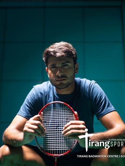 A player taking a moment between games. This dramatic shot from the Canva photoshoot highlights the professional atmosphere of our venues.