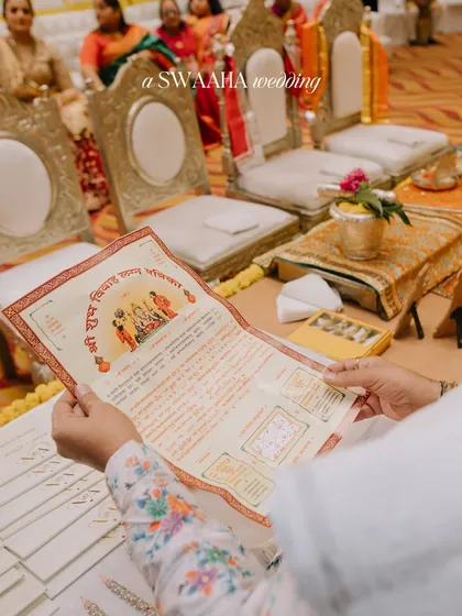 A close-up of a traditional wedding invitation, a key part of the sacred rituals.