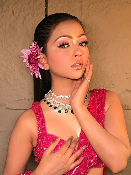 A close-up of the 'Rosemary' look, highlighting the soft pink eyeshadow and the flawless, dewy skin.