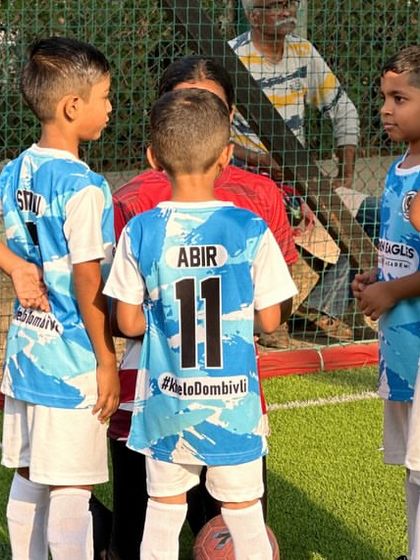 The team huddles up for a quick strategy talk. Teamwork is a lesson that starts early at Golden Eagles.