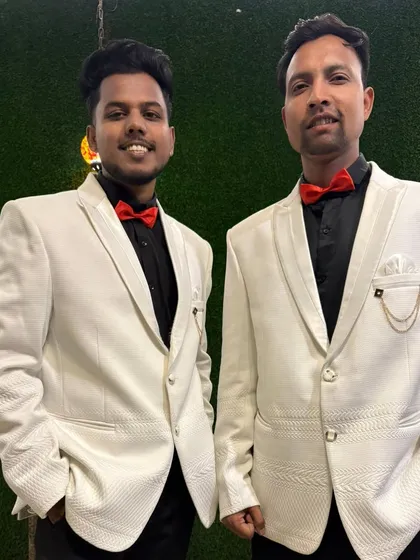 Two of our male dancers in their performance attire. A sharp, coordinated look is key to a professional stage presence.