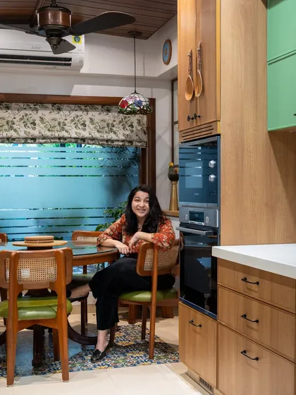 Here I am in a recently completed project, where the kitchen and dining area are designed as one connected space. Creating rooms that encourage togetherness is at the core of my design philosophy.
