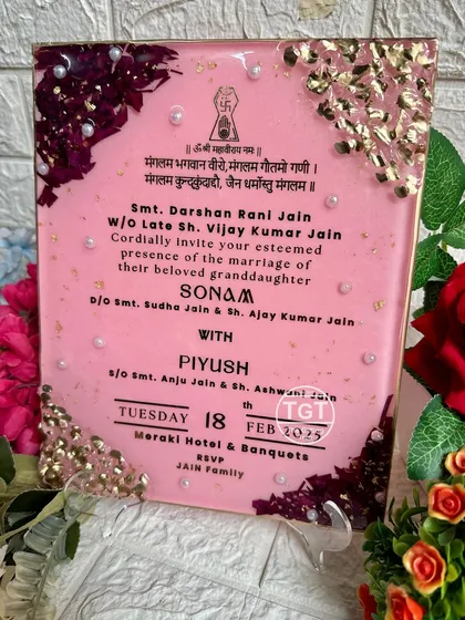 The invitation displayed on a stand, showing how it can be used as a decorative piece.