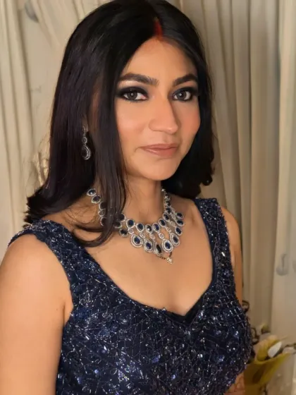 Rashi's reception look was all about the eyes. I created a dramatic blue smokey eye, paired with fresh, dewy skin and a nude lip to keep the focus on her stunning eye makeup.