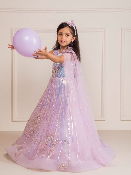 A playful moment in our butterfly gown, perfect for a magical, themed birthday party.