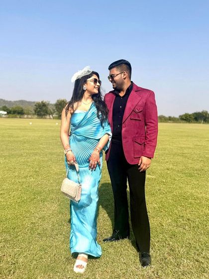 A lovely moment captured. Our client Mr. Avi Singal and his partner, with his bespoke red blazer adding a touch of vibrant color.