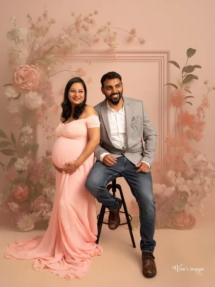 A classic and happy couple's portrait. Set against a beautiful pink floral backdrop, their smiles radiate the joy and excitement of this special time.