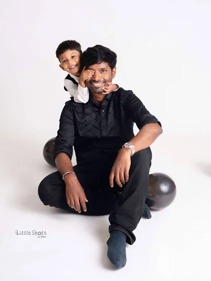 Capturing the playful and loving bond between a father and his son. This candid moment of laughter during a third birthday shoot shows the pure joy that I strive to preserve in my family photography sessions.