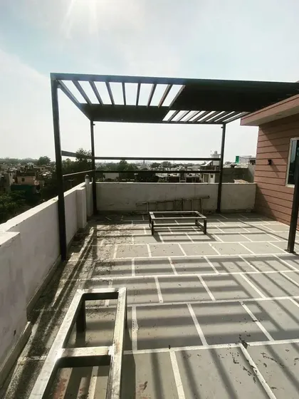 The pergola structure during the construction phase.