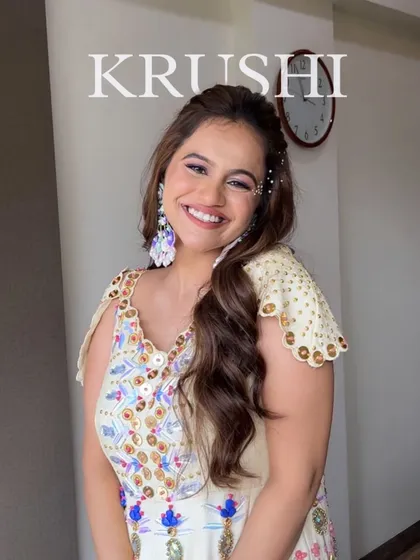 A cute and candid shot of the Haldi bride. Her joyful smile is the best part of this look, which is all about fresh skin and playful details.