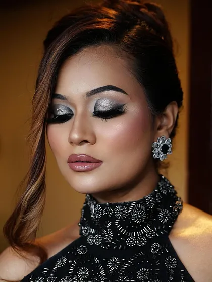 When in doubt, go bold. A close-up of these fierce and fabulous smoky eyes. The silver glitter adds a touch of drama to the classic black smokey look.