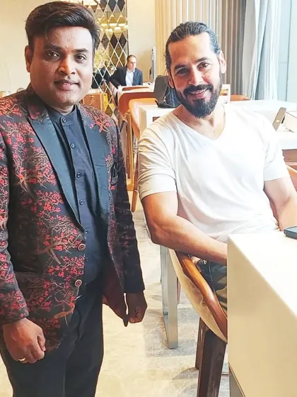 A photo with actor and model Dino Morea after a private performance. I am experienced in entertaining high-profile guests with discretion and professionalism.