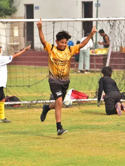 The pure joy of scoring a goal. A player celebrates his success during a league match.