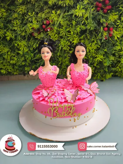 Double the fun with this Barbie cake featuring two dolls in pink gowns. It's perfect for a shared birthday party or for a girl who just loves Barbie.