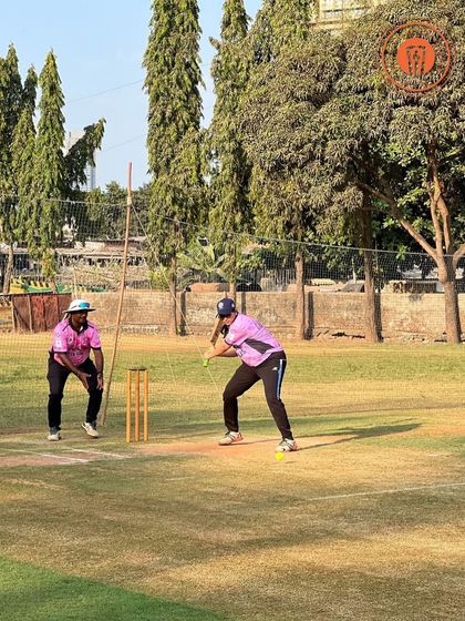 A female batter gets into position, ready to play a shot in a women's PPL match.