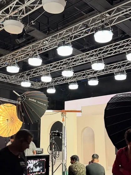 Another angle of the Limelight studio setup, showing the combination of overhead lighting and large floor-standing modifiers like parabolic umbrellas.